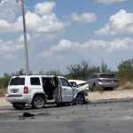 Two damaged SUVs after a car accident.