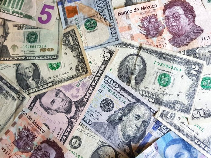 Peso and dollar bills