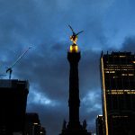 Mexico City cityscape view at night with cloudy sky