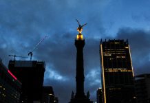 Mexico City cityscape view at night with cloudy sky