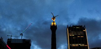 Mexico City cityscape view at night with cloudy sky