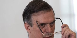 Marcelo Ebrard looks over his glasses