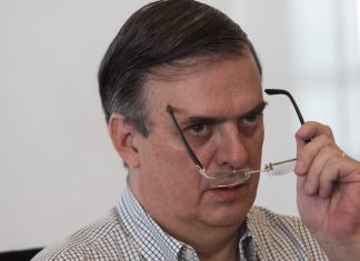 Marcelo Ebrard looks over his glasses