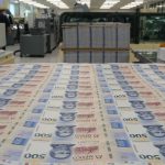 Rows of 500 peso bills just printed in Mexico's currency minting facilities.s