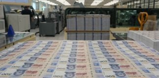 Rows of 500 peso bills just printed in Mexico's currency minting facilities.s