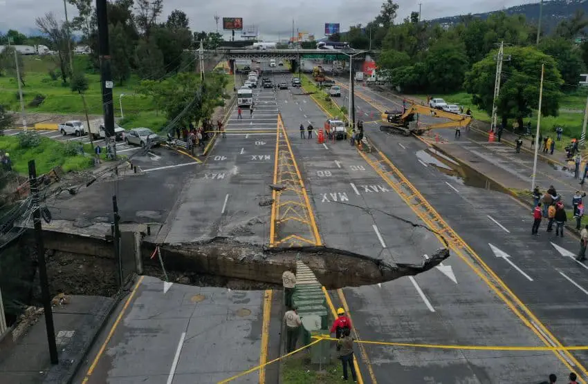 A wide view of a sinkhole that opened up along Guadalajara's Avenida López Mateos