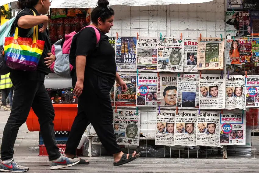 A news stand in Mexico City with papers showing arrest of El Mayo Zambada and Joaquín Guzmán López