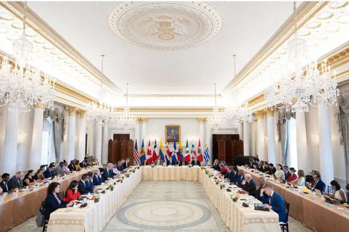 Ministerial meeting of the Americas Partnership for Economic Prosperity, with member country representatives seated at banquet tables in a foermal room at the US White House.