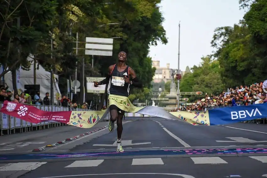 Nigerian Frederick Yeko Domongole crossing the finish line at the 2024 Mexico City half marathon