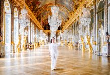 The Mexican actress Salma Hayek Pinault holding the 2024 Olympic torch in the Palace of Versailles