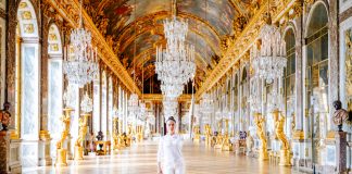 The Mexican actress Salma Hayek Pinault holding the 2024 Olympic torch in the Palace of Versailles