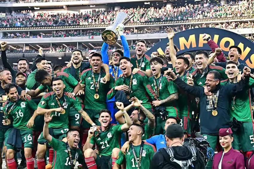 Mexico's national team posing for a group photo with their trophy for the Concacaf World Cup 