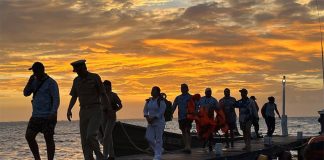 Six members of a fishing charter arrive at a dock in Isla Mujeres, Quintana Roo after being rescued.