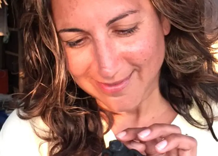 Tamanna Bembenek with a baby sea turtle