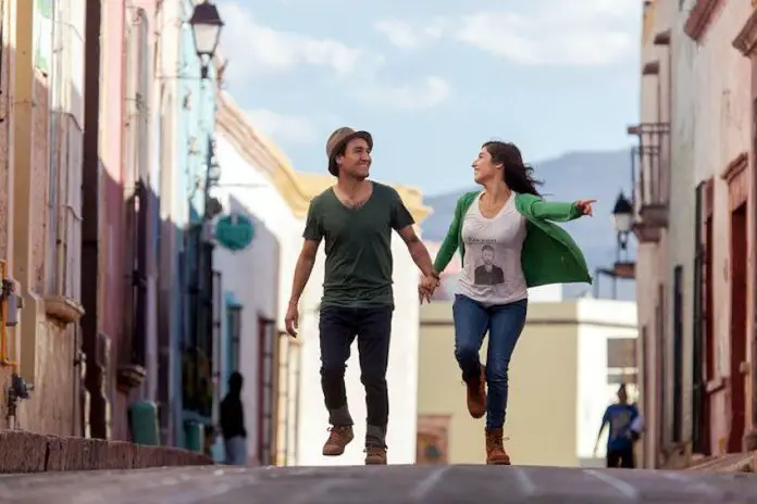 A date skipping through the street