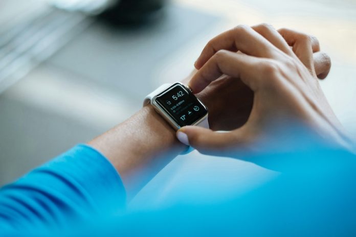 A woman checking a smart watch