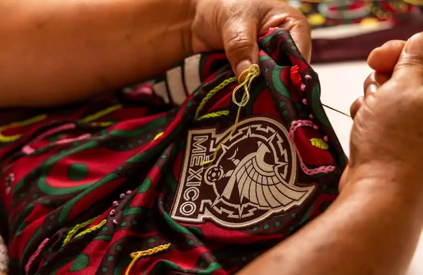 A Mexico soccer jersey being stitched