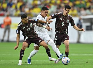 With one goal in three games, Mexico makes a ‘disastrous early exit’ from the Copa América Two Mexican soccer players in red uniforms go after an Ecuadorian player in white with the ball, before Mexico was eliminated from the Copa América.