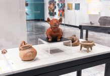 Mexican artifacts including pottery figure of a dog and dishware on display at the Nashville Parthenon museum
