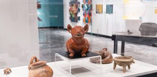 Mexican artifacts including pottery figure of a dog and dishware on display at the Nashville Parthenon museum