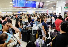Passengers wait in the crowded Cancún airport during the global Microsoft IT meltdown in Mexico.