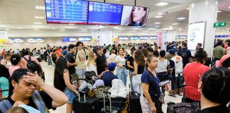 Passengers wait in the crowded Cancún airport during the global Microsoft IT meltdown in Mexico.