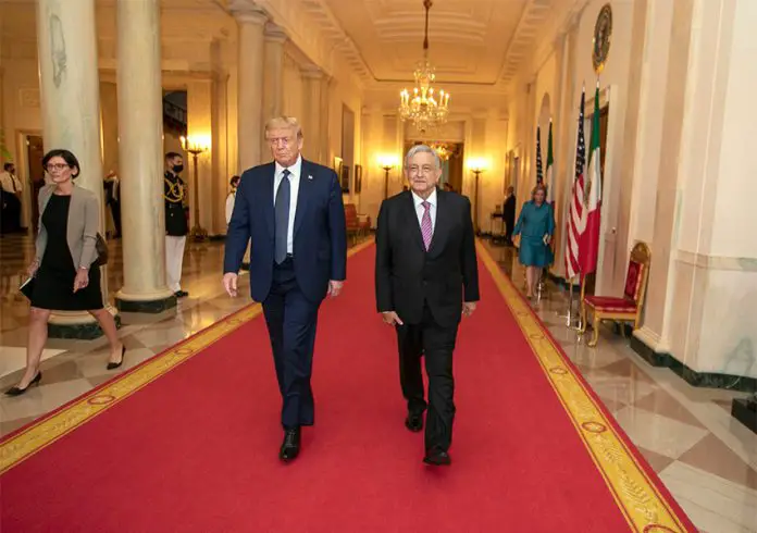 AMLOAMLO and Donald Trump walk down a red carpet in an elegant hallway. and Donald Trump walk down a red carpet in a long corridor.