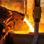 A steel furnace pouring molten steel.