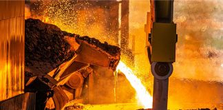 A steel furnace pouring molten steel.