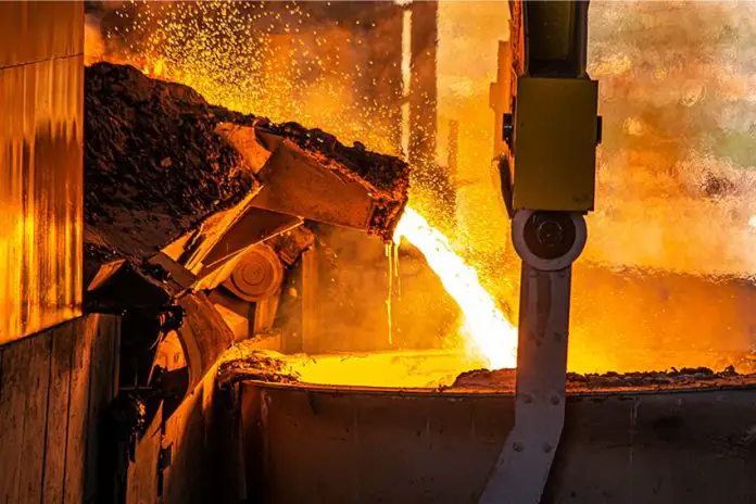 A steel furnace pouring molten steel.