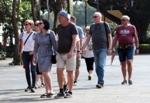 International tourists wander a historic plaza in Cuernavaca, Morelos, Mexico.