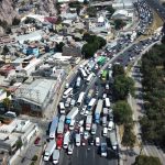 Aerial view of a highway in Mexico with trucks