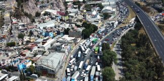 Aerial view of a highway in Mexico with trucks