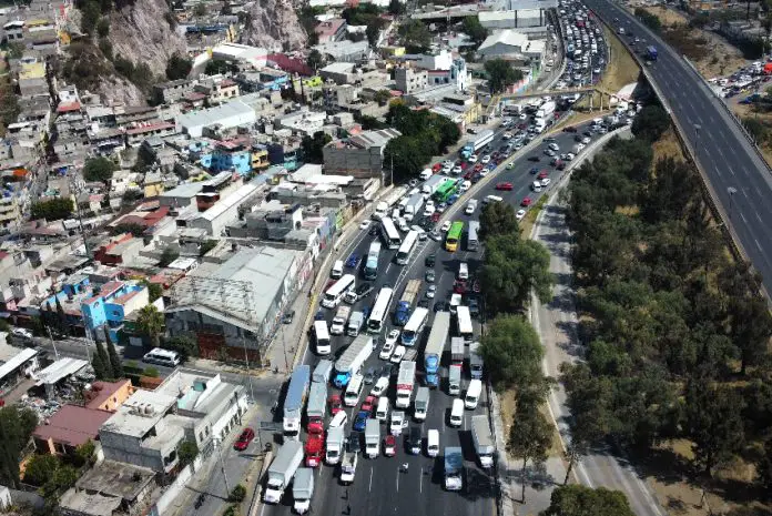 Aerial view of a highway in Mexico with trucks