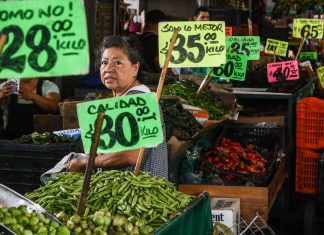 Price signs in a produce market, showing inflation in Mexico