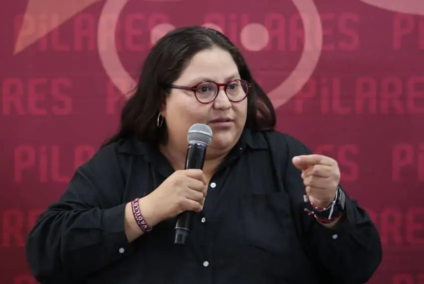 Women's Minister Citlalli Hernandez speaks into a microphone