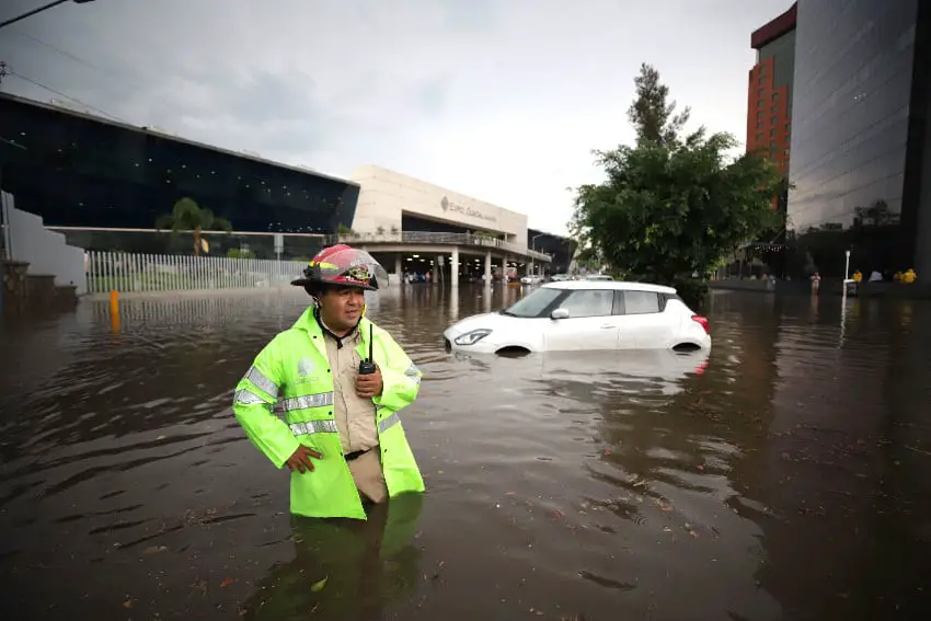 A fireman on a flooded street in Guadalajara