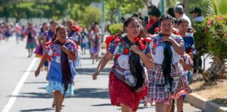 Women of all ages wearing huipiles and other traditional garments run in the Coapan, Puebla, Tortilla Race.