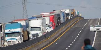 Semi-trailers wait in long lines on the Mexico-Puebla highway, before the blockade ended on Saturday.