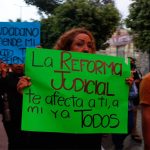 Mexican judges in Guerrero, Mexico, at a march protesting a controversial judicial reform bill, holding signs in Spanish