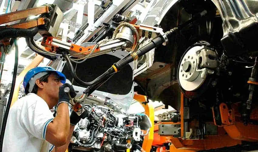 Worker at an automotive manufacturing plant in Mexico, one of the country's top exports to Canada