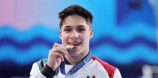 Diver Osmar Olvera bites his silver medal. What do Mexican Olympic medalists win when they come home?