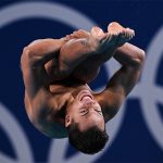 Mexican diver Osmar Olvera caught upside down in mid-air during a dive at the semifinals of the 2024 Olympics 3-meter springboard diving event