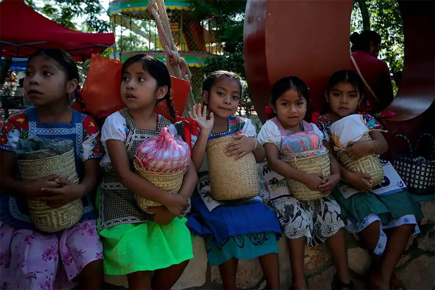 A group of children sits waiting to compete in the annual tortilla race in Coapan, Puebla.