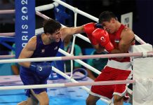 Mexican boxer Marco Verde fights Asadkhuja Muydinkhujaev of Uzbekistan at the Paris 2024 Olympics.