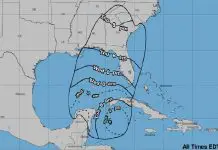 Map of southeastern coast of United States and eastern Caribbean coast showing Mexico, Belize and Guatemala, with radii predicting the earliest reasonable times for the arrivaal of tropical storm force winds.