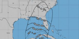 Map of southeastern coast of United States and eastern Caribbean coast showing Mexico, Belize and Guatemala, with radii predicting the earliest reasonable times for the arrivaal of tropical storm force winds.