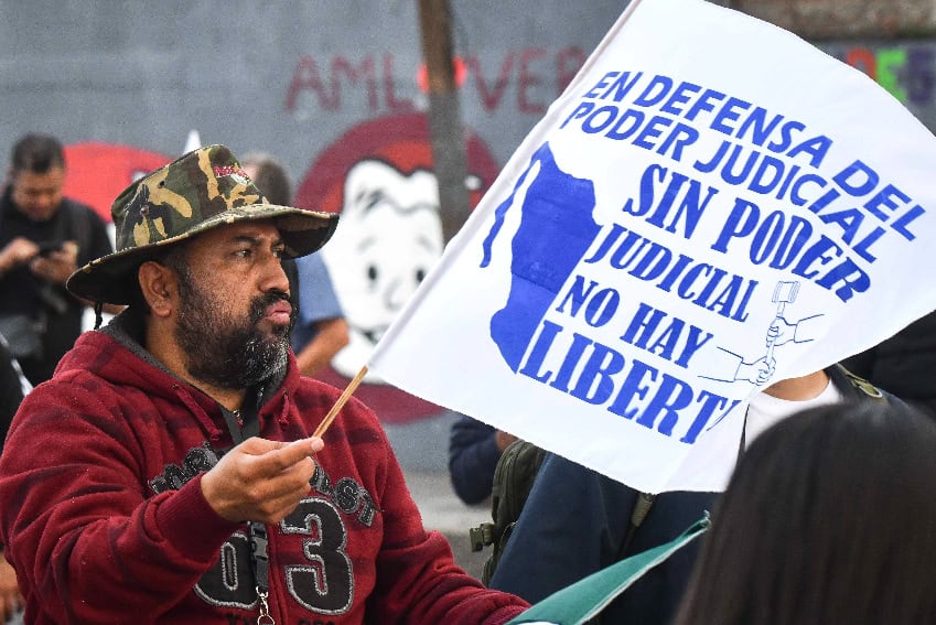 A protester holds a sign outside Chamber of Deputies