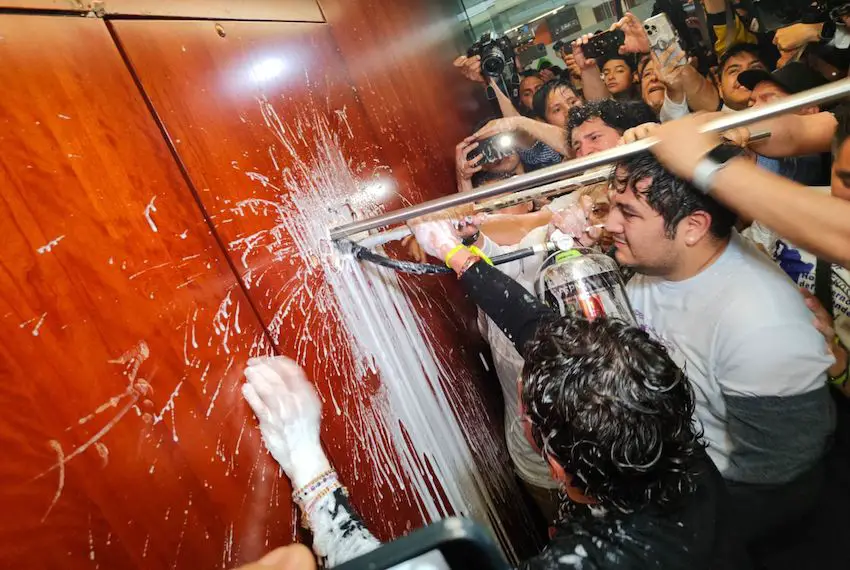 A large group of protesters burst into the Senate on Tuesday evening, causing damage to the legislative chamber. 