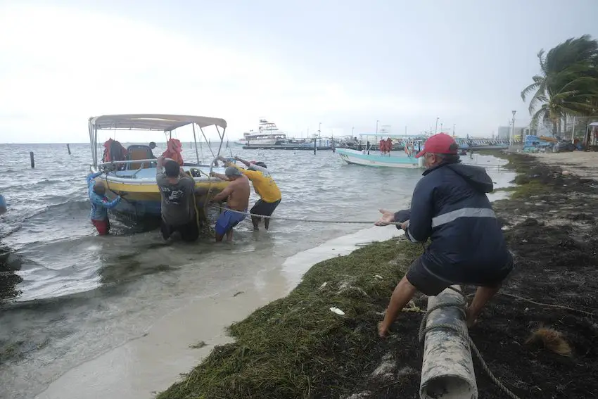 Streets were flooded and power outages were reported in many areas of Cancún on Tuesday as Hurricane Helene gained strength in the Caribbean Sea. 